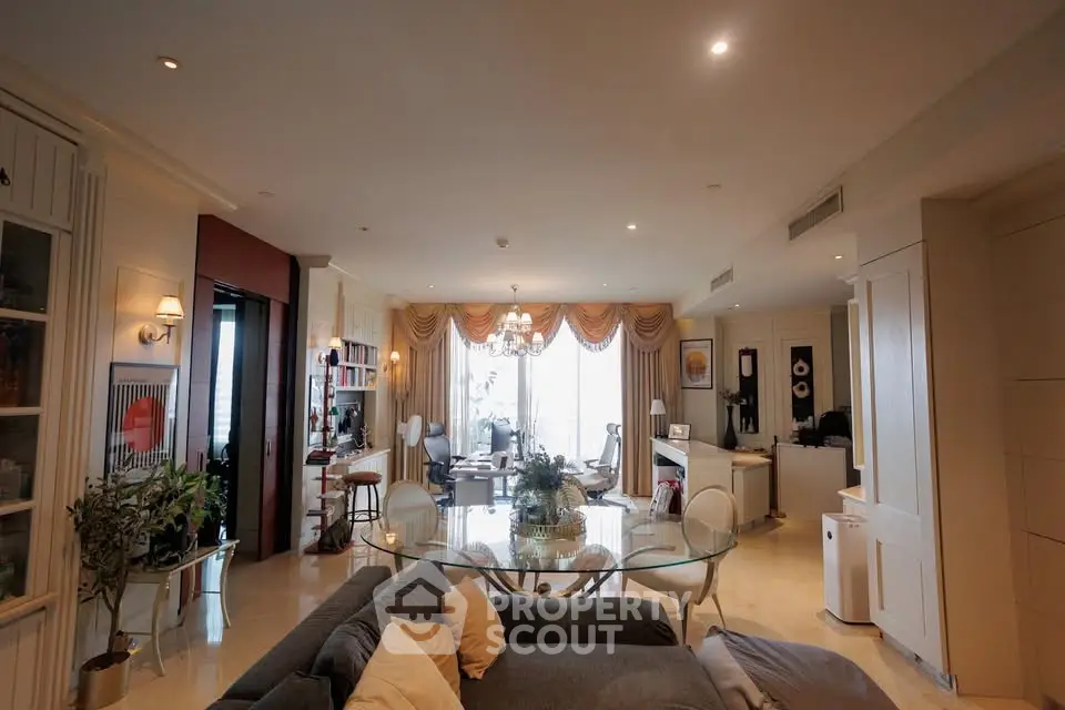 Spacious and elegant living room with modern decor and large windows.