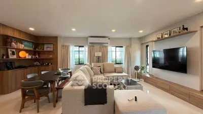Spacious modern living room with stylish furniture and large windows