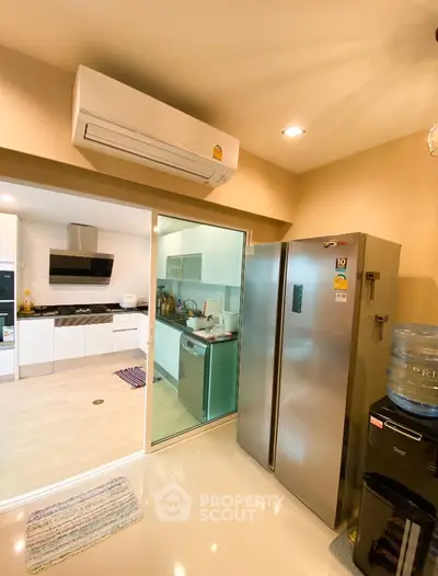 Modern kitchen with stainless steel appliances and open layout