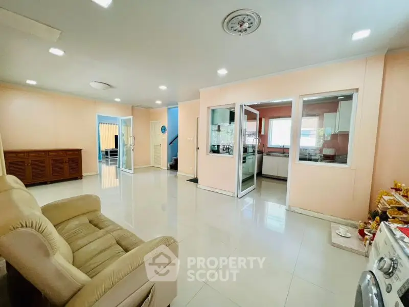 Spacious living room with modern design and open kitchen layout