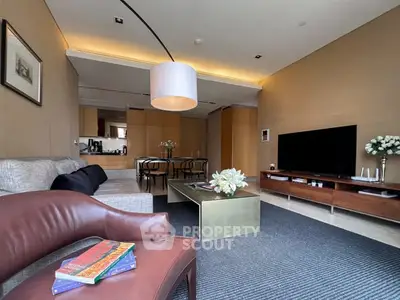 Spacious modern living room with elegant decor and open kitchen layout