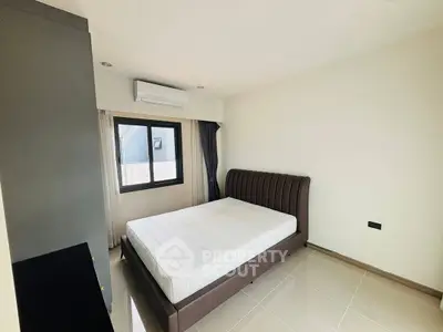 Modern minimalist bedroom with sleek design and natural light