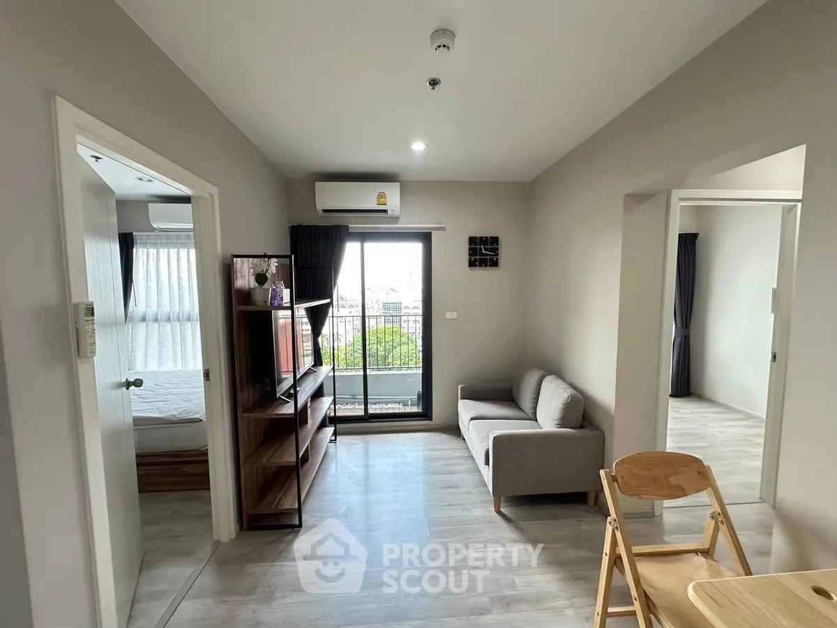 Modern living room with balcony access and stylish decor