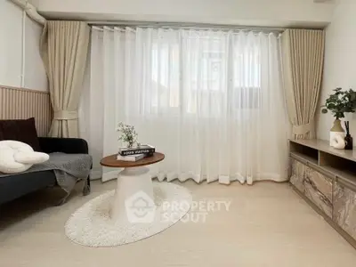 Elegant living room with modern decor and natural light