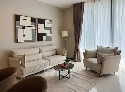 Elegant living room with modern decor and large windows for natural light.