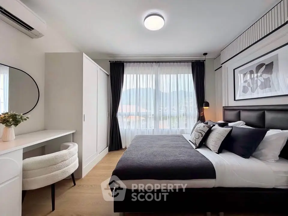 Modern bedroom with stylish decor and natural light