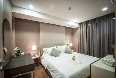 Luxurious bedroom with elegant decor and cozy lighting, perfect for relaxation and comfort.