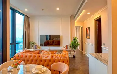 Luxurious living room with elegant decor and stunning city view, featuring plush seating and modern design.
