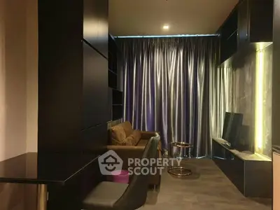 Modern living room with sleek furniture and floor-to-ceiling curtains