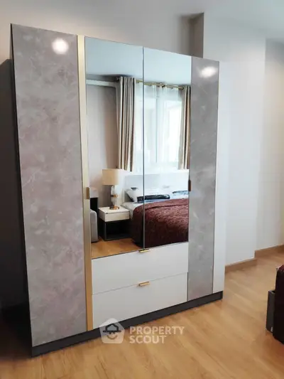 Modern bedroom with stylish wardrobe and elegant decor