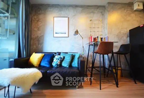 Stylish modern living room with cozy sofa and chic decor in urban apartment