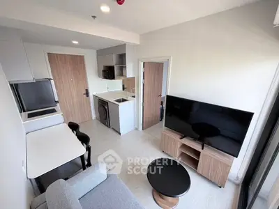 Modern compact living room with open kitchen and stylish furniture