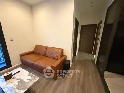 Cozy living room with brown leather sofa and modern decor