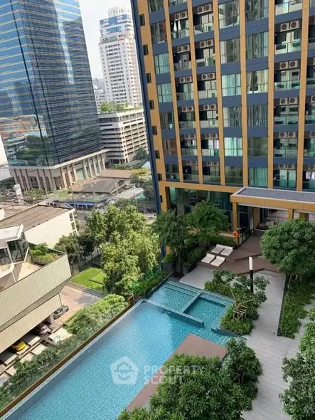 Luxurious high-rise building with stunning pool and city view