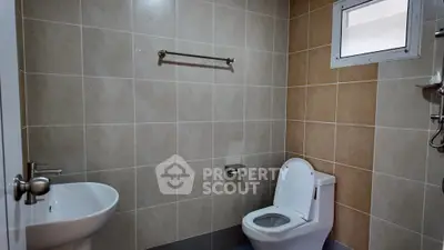 Modern bathroom with sleek fixtures and neutral tile design