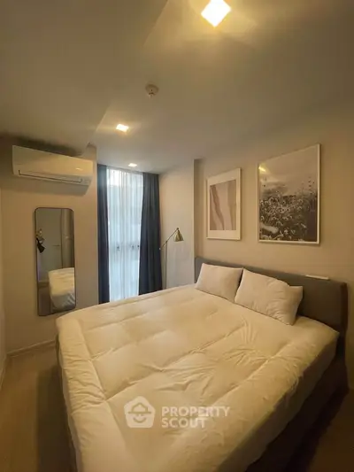 Cozy modern bedroom with stylish decor and natural light