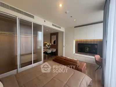Modern bedroom with stylish decor and cozy seating area