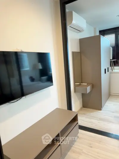 Modern living room with sleek TV setup and stylish storage solutions