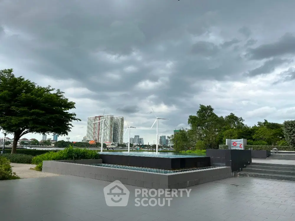 Stunning urban view with modern architecture and lush greenery under dramatic skies.