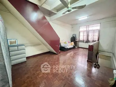 Spacious living area with wooden flooring and modern decor