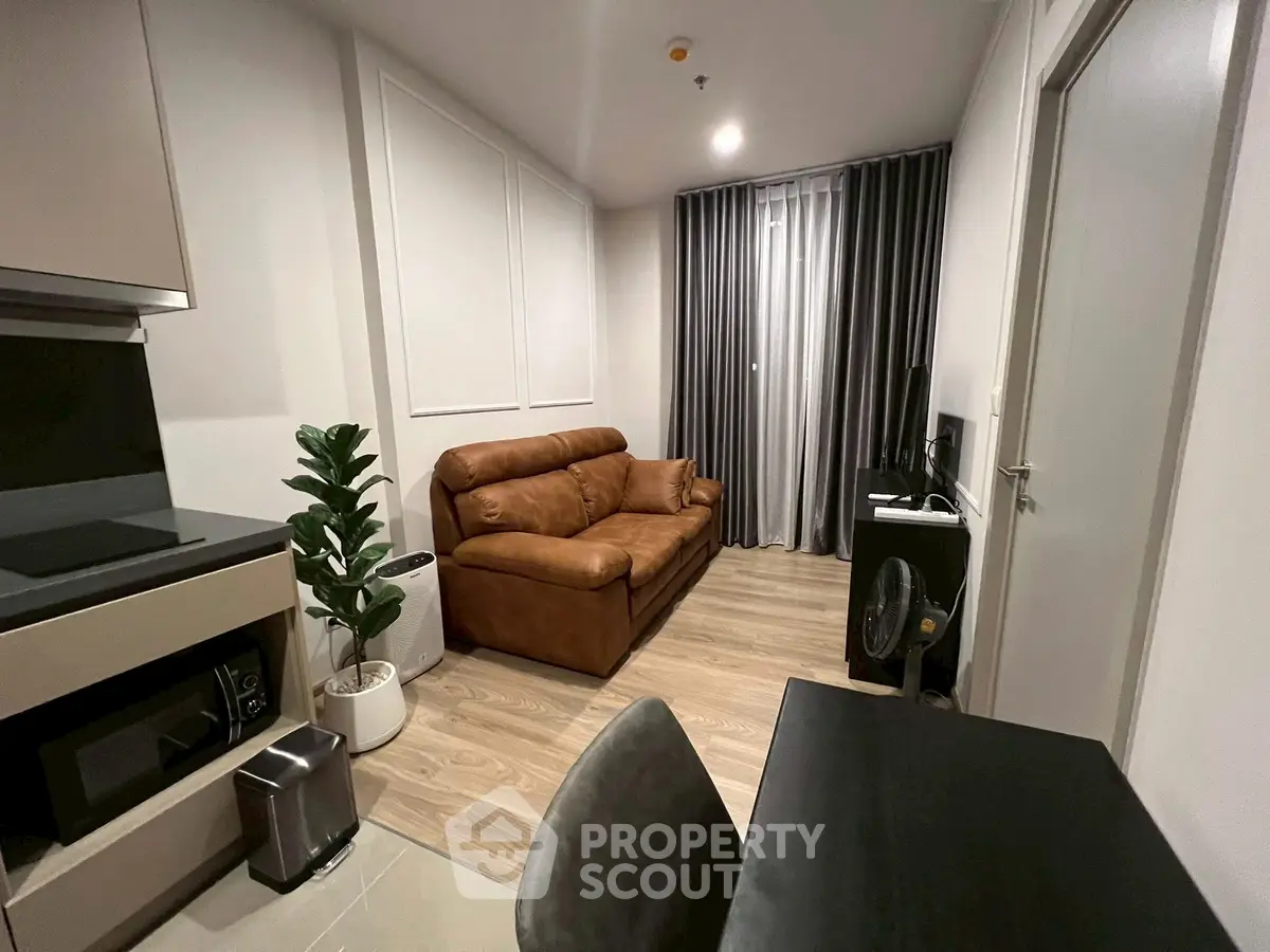 Modern living room with brown leather sofa and stylish decor