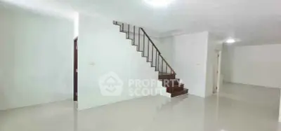 Spacious modern interior with sleek staircase and glossy flooring