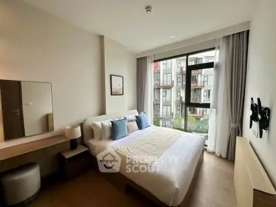 Modern bedroom with large window and stylish decor in urban apartment
