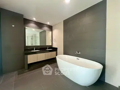 Luxurious modern bathroom with freestanding bathtub and dual sinks