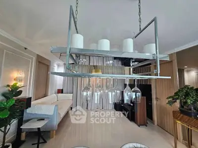 Luxurious living room with modern chandelier and elegant decor