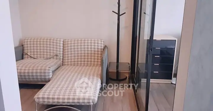 Cozy living room with checkered sofa and modern decor