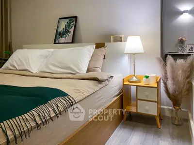Cozy bedroom with stylish decor, warm lighting, and modern furnishings, perfect for relaxation and comfort in a contemporary home.