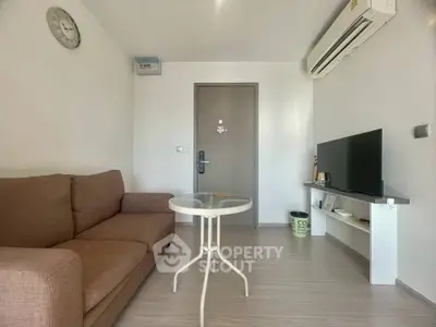 Modern living room with air conditioning and cozy sofa in a stylish apartment.