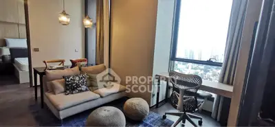 Modern living room with city view, cozy seating, and stylish workspace