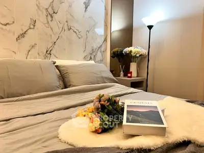 Luxurious bedroom with elegant decor and soft lighting, perfect for relaxation.