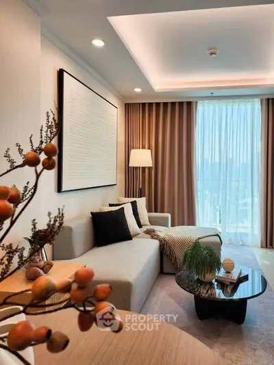 Elegant living room with modern decor and large window view