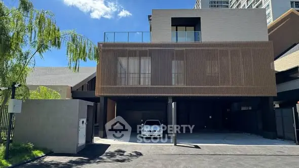 Modern luxury home exterior with sleek design and spacious driveway