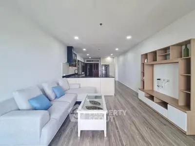 Spacious modern living room with open kitchen and stylish furniture