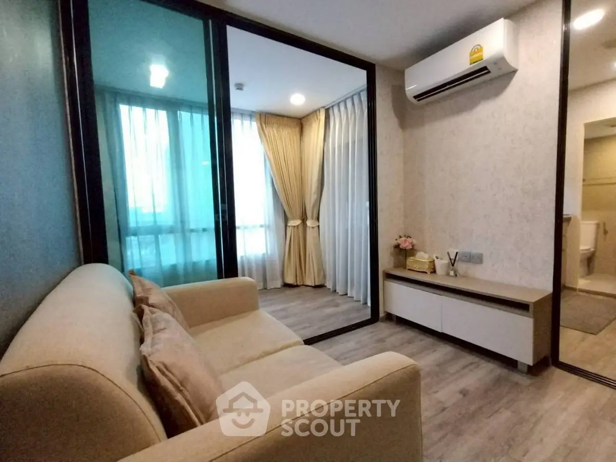 Modern living room with cozy sofa and air conditioning in stylish apartment