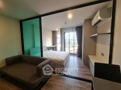 Modern studio apartment with balcony and stylish furnishings