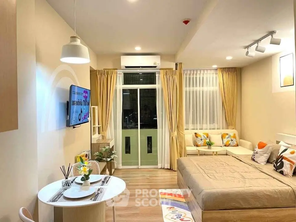 Modern studio apartment with cozy living area and stylish decor