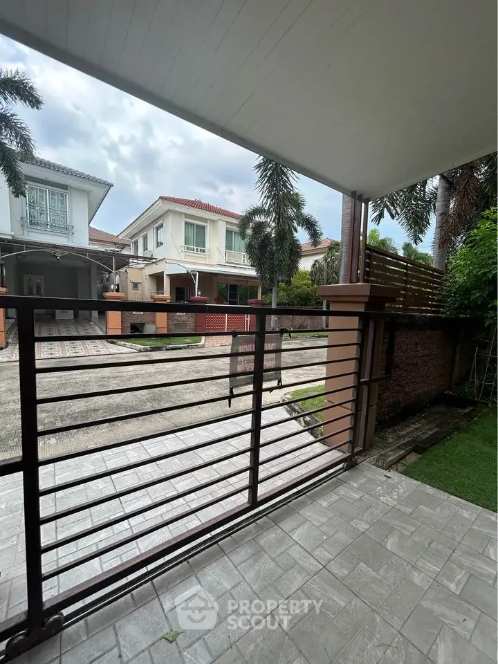 Charming suburban home with spacious driveway and lush greenery, perfect for family living.