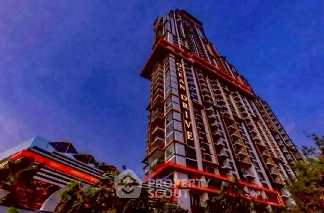 Stunning high-rise building with modern architecture and vibrant lighting against a twilight sky.