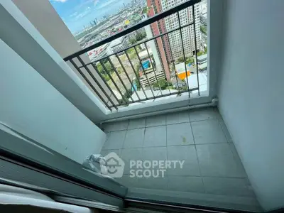 High-rise apartment balcony with stunning cityscape view, perfect for urban living enthusiasts.