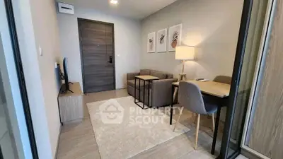 Modern living room with cozy sofa, TV, and stylish decor in a contemporary apartment.