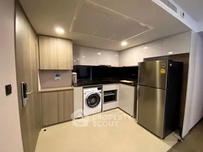 Modern kitchen with sleek appliances and ample storage space