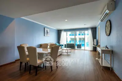 Spacious living room with modern decor and large windows for natural light.