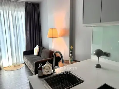 Modern apartment interior with cozy living room and sleek kitchen design