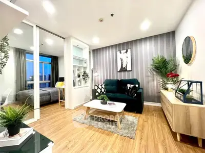Modern living room with stylish decor and view into cozy bedroom