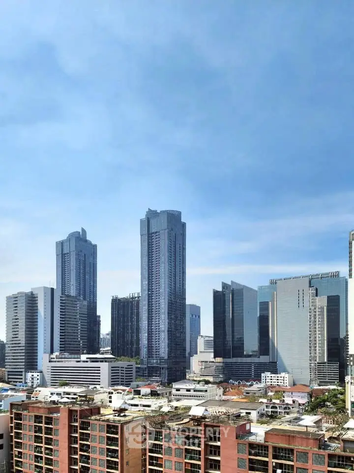 Stunning cityscape view showcasing modern skyscrapers and urban architecture under a clear blue sky.