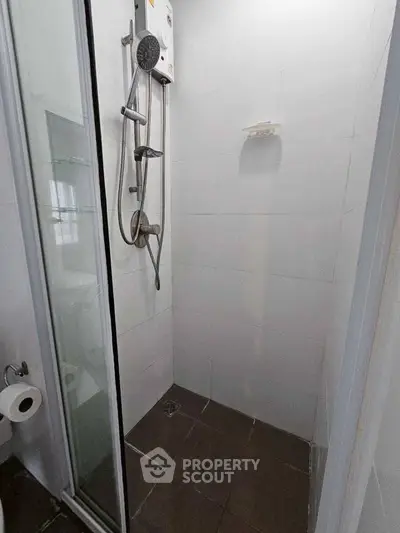 Compact bathroom with modern shower and glass door enclosure